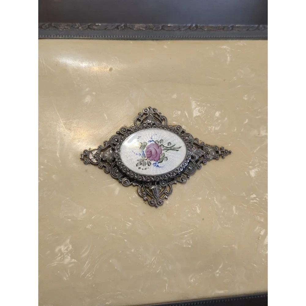 antique etched brass trinket box features a hinged lid Music Box